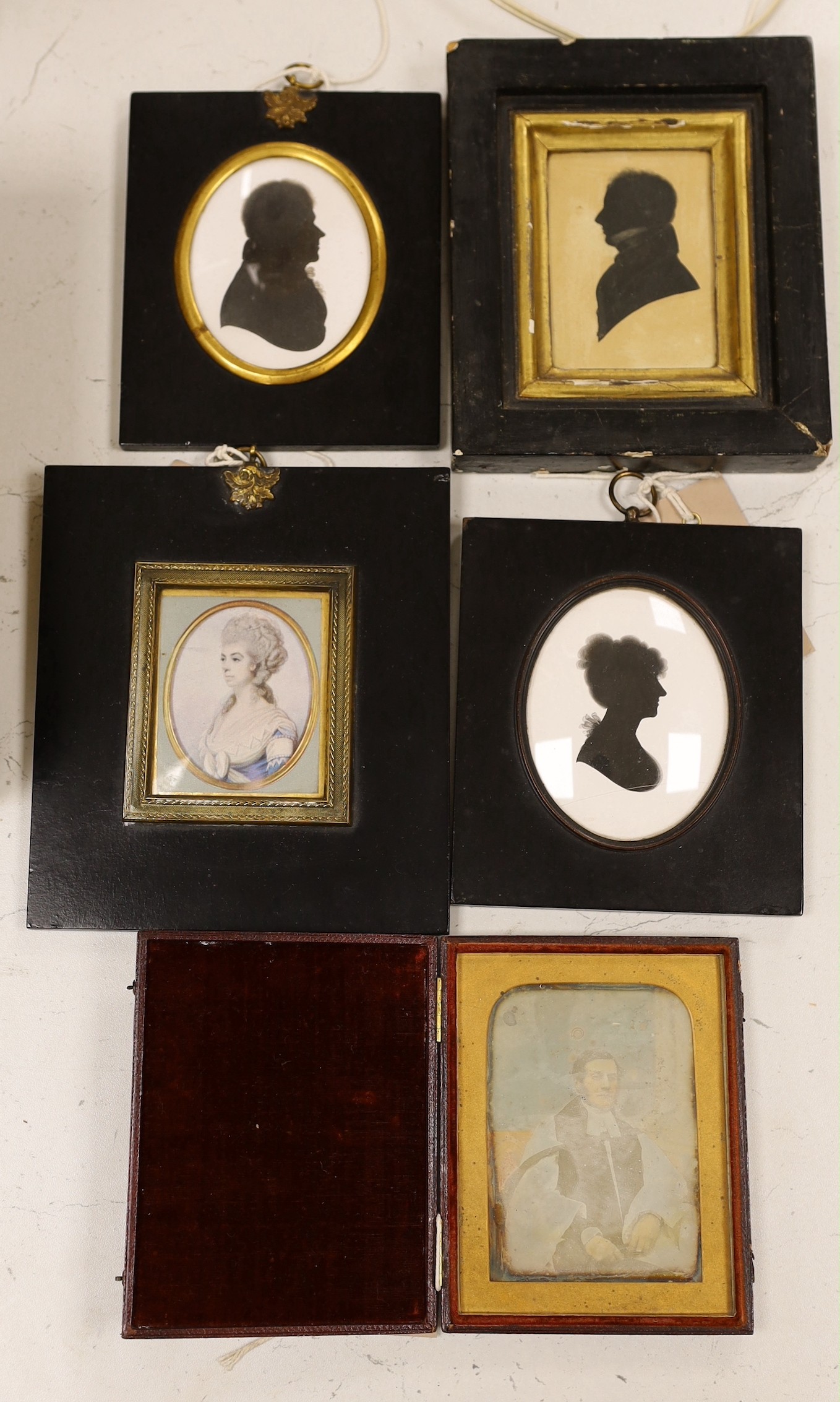 John Miers (1758-1821), painted silhouette of George Augustus Legge 1826, 8 x 6cm, two painted plaster silhouettes, a printed silk miniature and a daguerrotype (5)